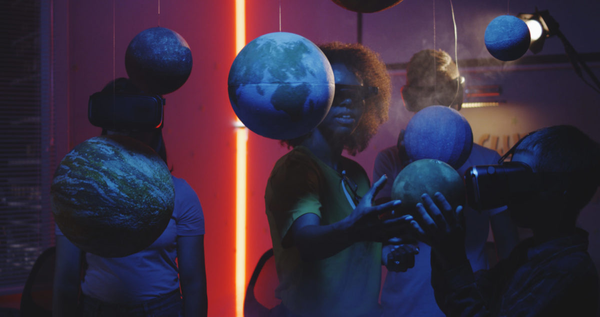 Students learning astronomy in Museums Space Exhibition with VR headset