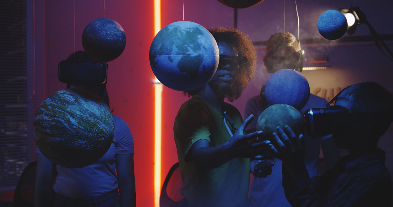 Students learning astronomy in museum with VR headset
