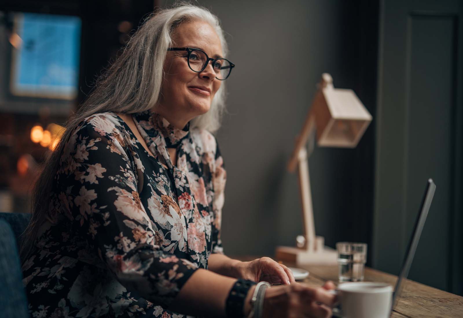 Woman sitting at work desk.