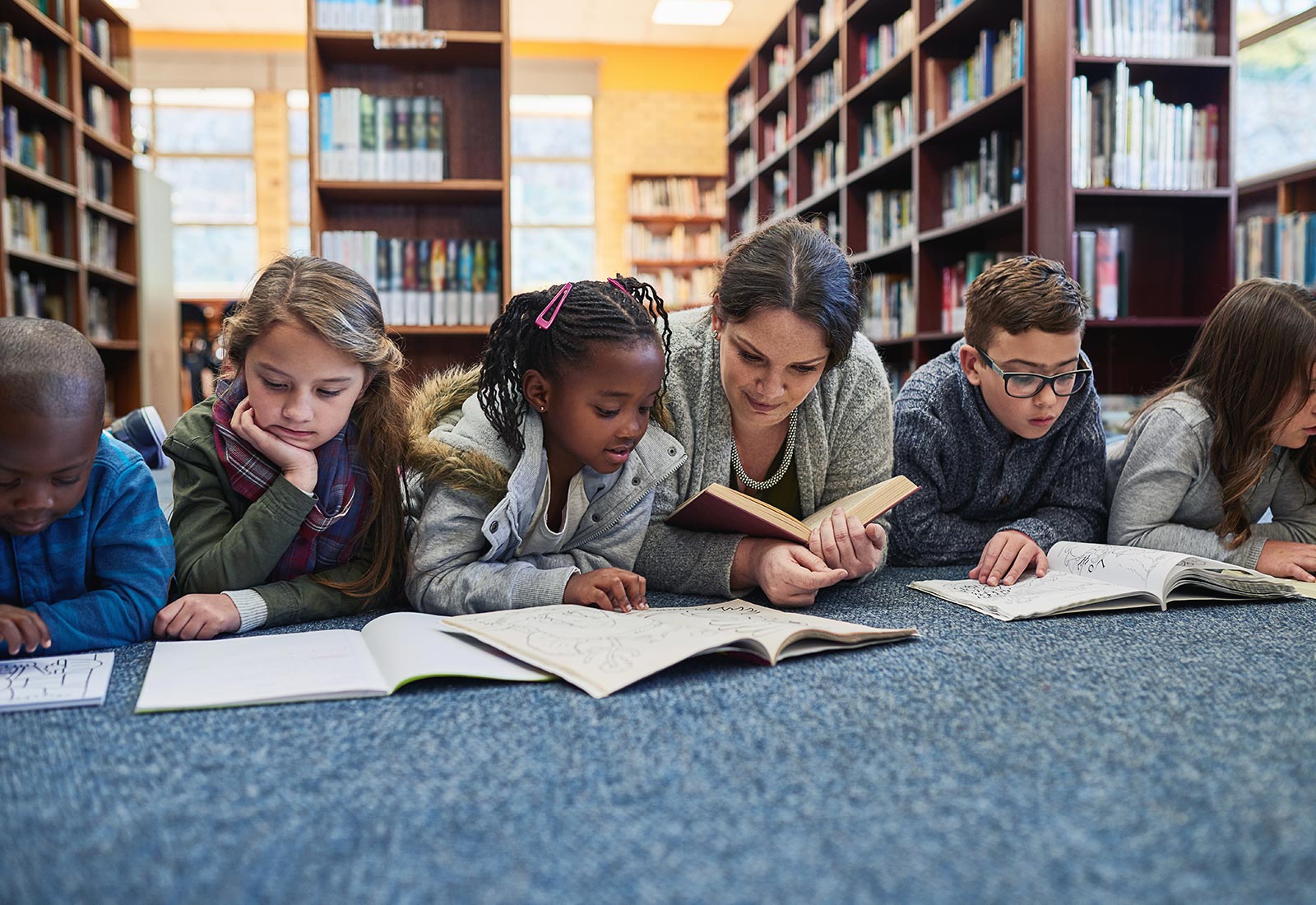 Children Reading on Library Floor