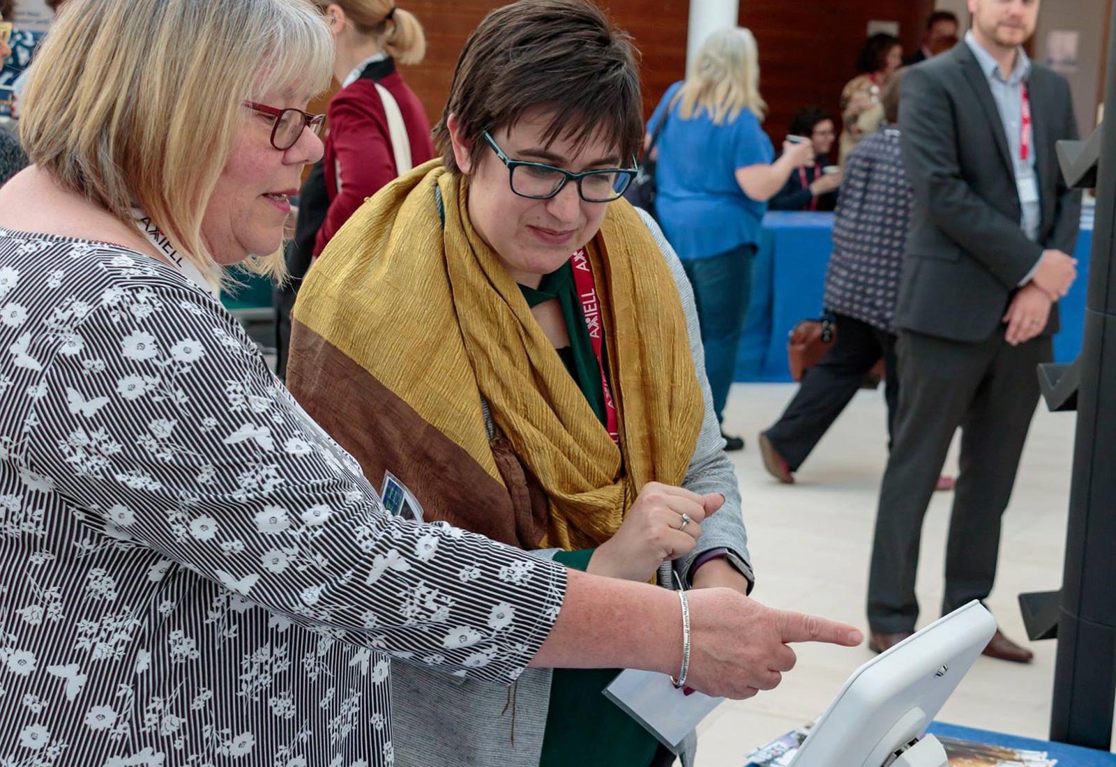 User conference visitors using tablet