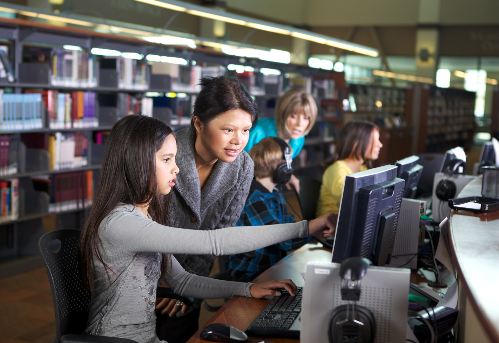 Student showing parent item on computer