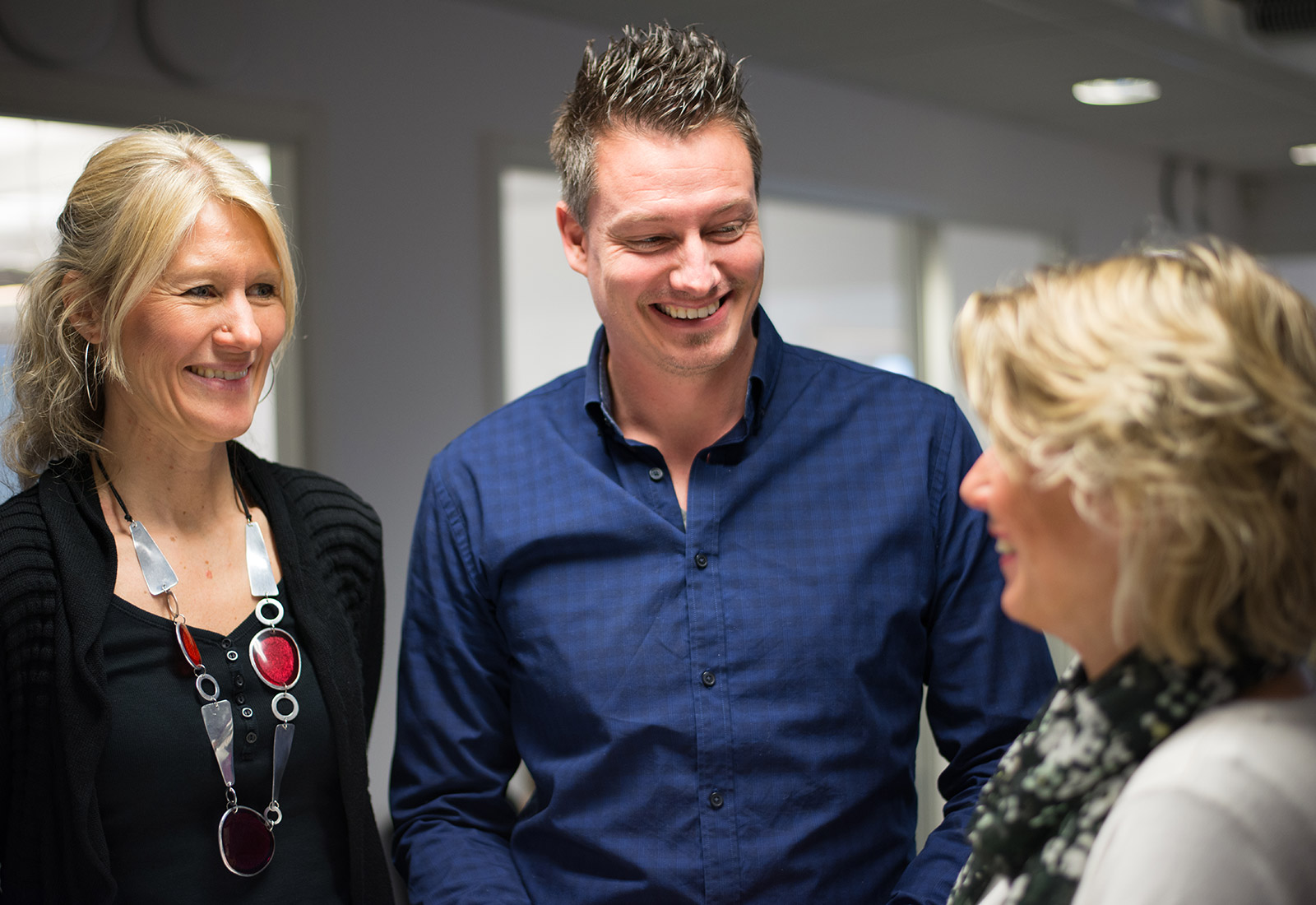 Two women and a Man Talking